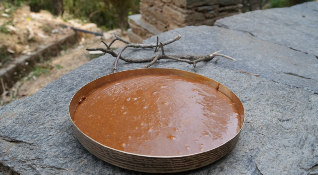 Freshly made khoya mixture cooling in a tray for Bal Mithai