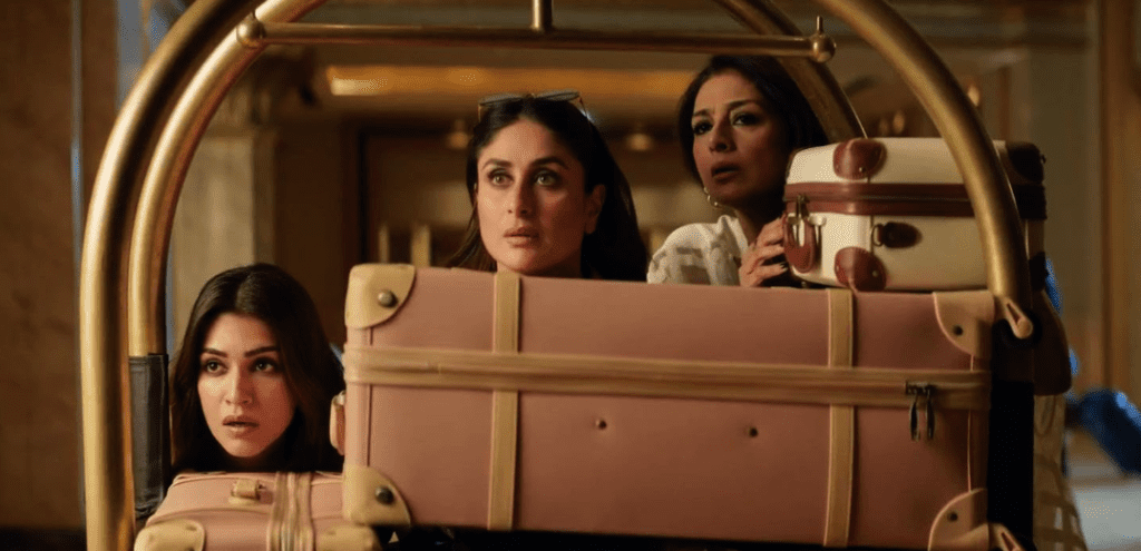 Kareena Kapoor Khan, and Kriti Sanon in Crew (2024). Tabu, Kareena Kapoor Khan, and Kriti Sanon peeping from behind the luggage.