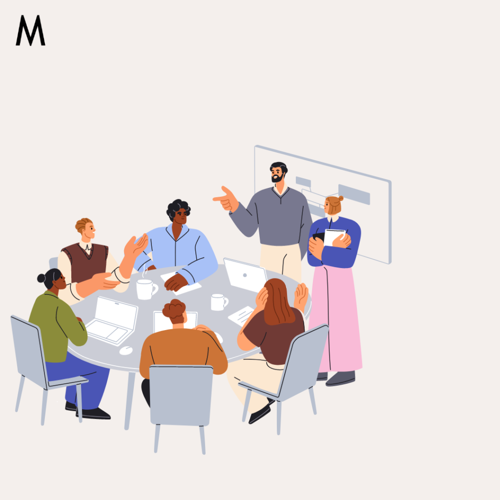 An illustration of a diverse group of people having a meeting around a table. Some are seated with laptops and coffee cups, while others are standing, one pointing and another holding a tablet. The group appears to be engaged in an active discussion or brainstorming session | MindBrews