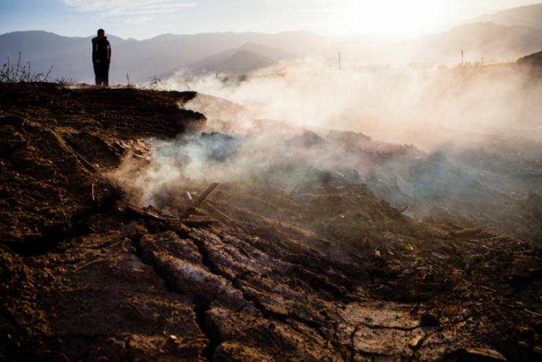 Lawson Dump as smoke rises from a fire smoldering belowground. Although it was ordered closed in 2006, underground fires continued to burn for years afterward, and residents of nearby mobile home parks continued to complain about noxious odors and possible contamination.