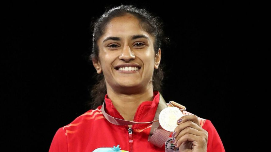 Vinesh Phogat poses with her gold medal at the 2018 Commonwealth Games.